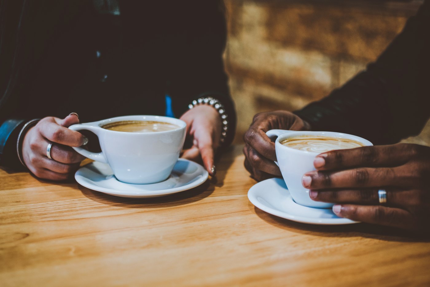 Coffee cups with hands