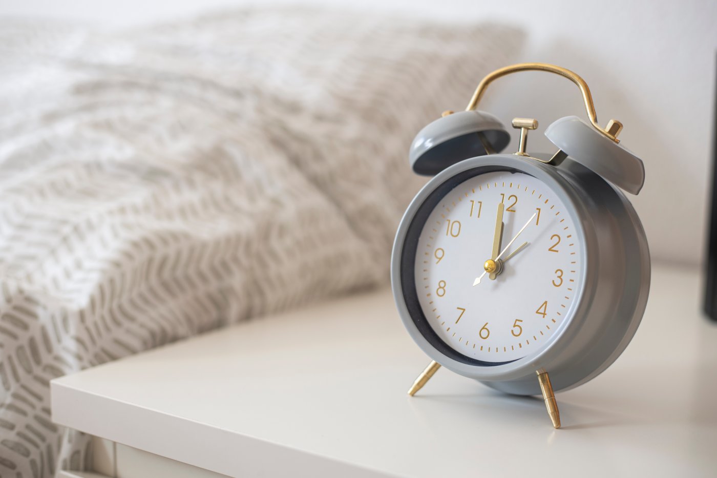 Alarm clock on the nightstand at midnight