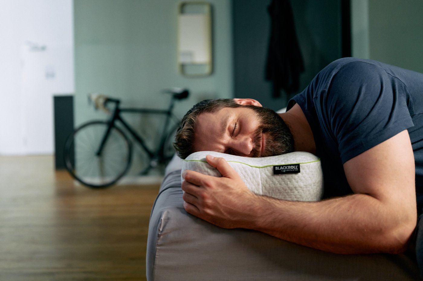 A person sleeping on the BLACKROLL Pillow