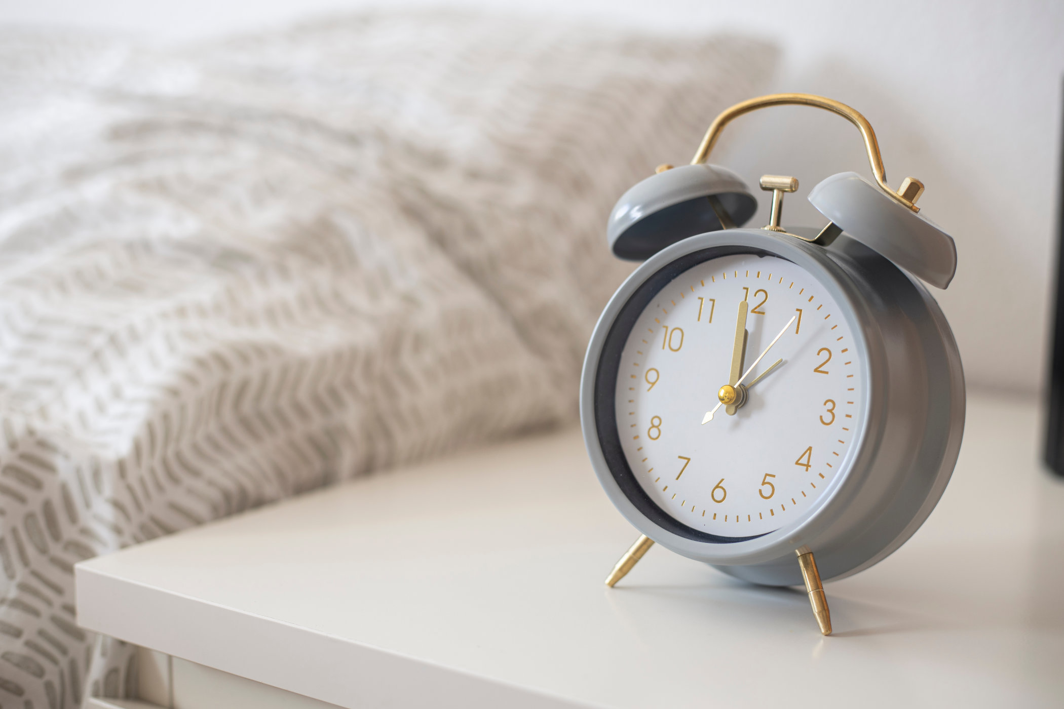 Alarm clock on the nightstand at midnight