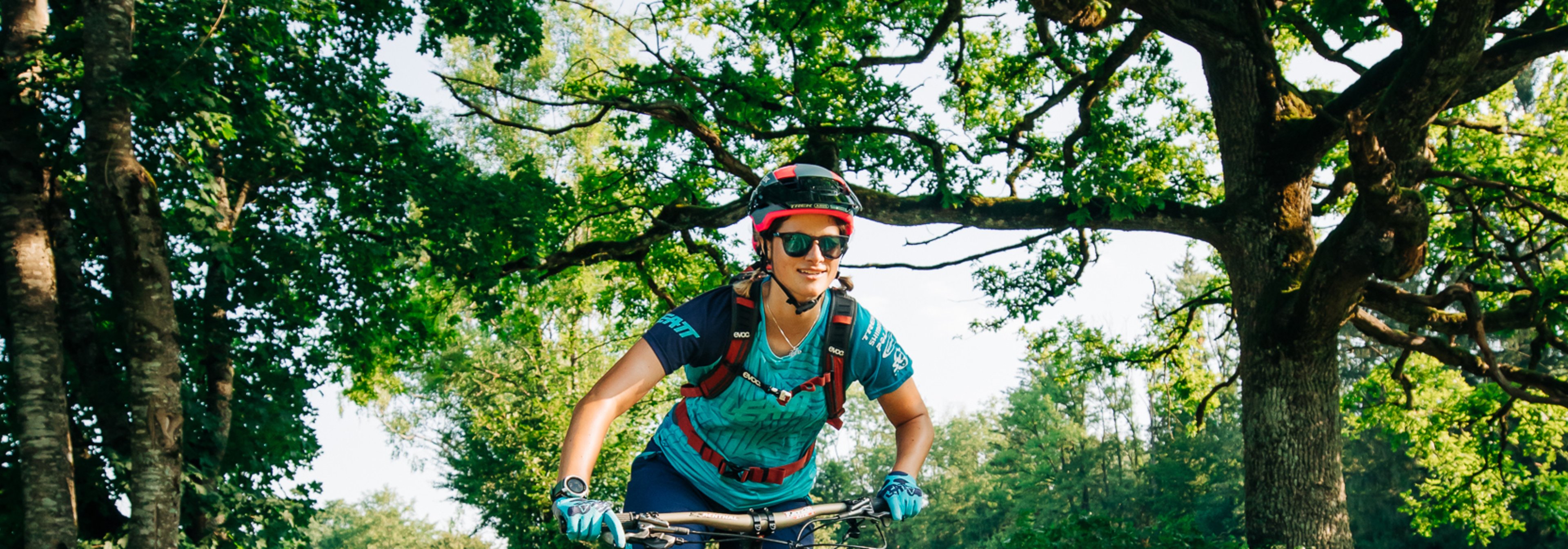 https://storage.googleapis.com/oneworld-prod/assets/mountain-biking.jpg?v=1658476291