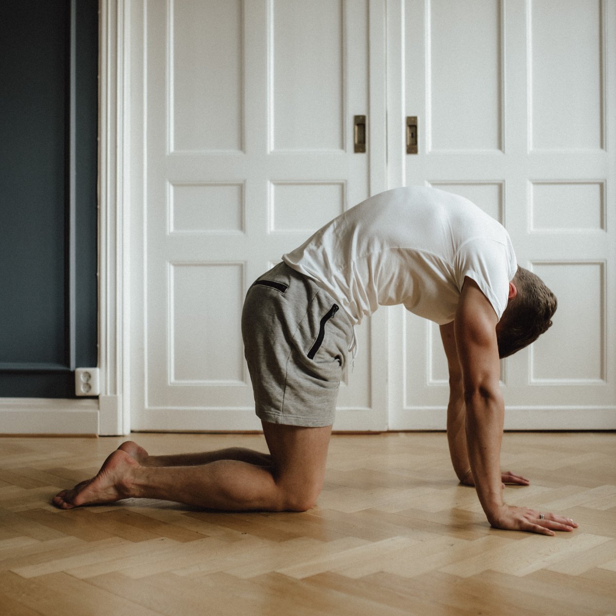 Alternating Cat-Cow: From a tabletop position, round your upper back. Segment by segment, starting with the thoracic spine and looking toward your navel.