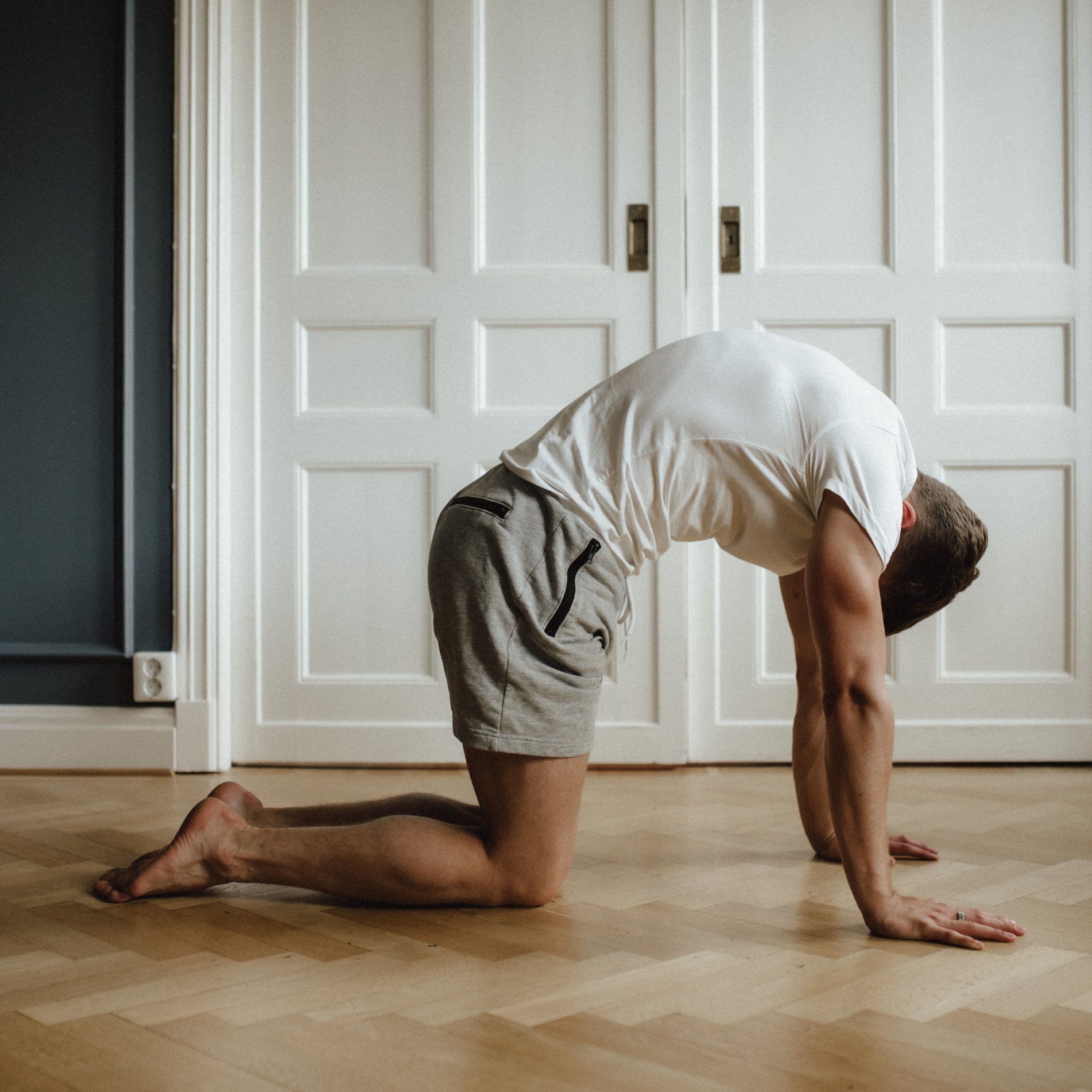 Alternating Cat-Cow: From a tabletop position, round your upper back. Segment by segment, starting with the thoracic spine and looking toward your navel.