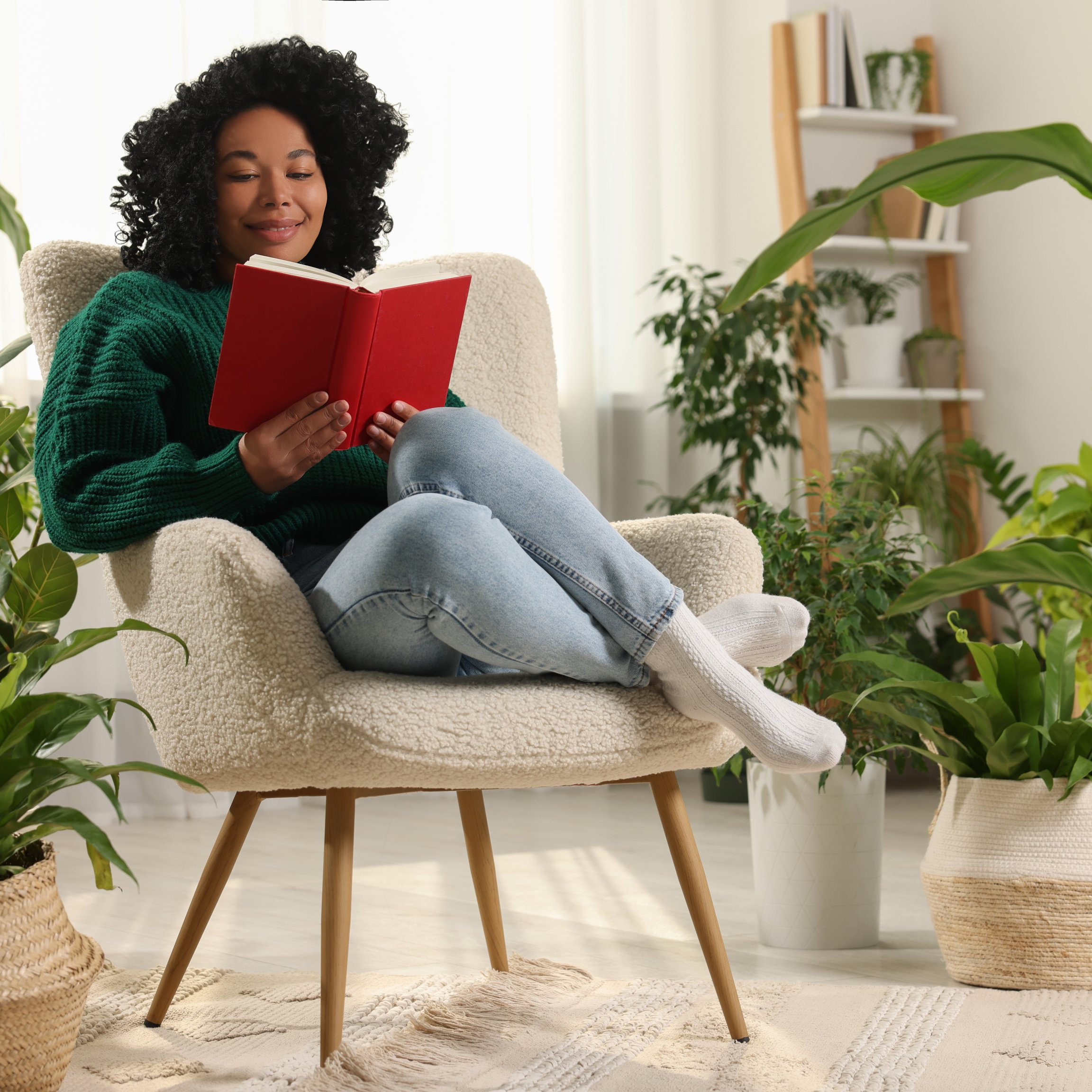 A woman reads a book in a relaxed atmosphere