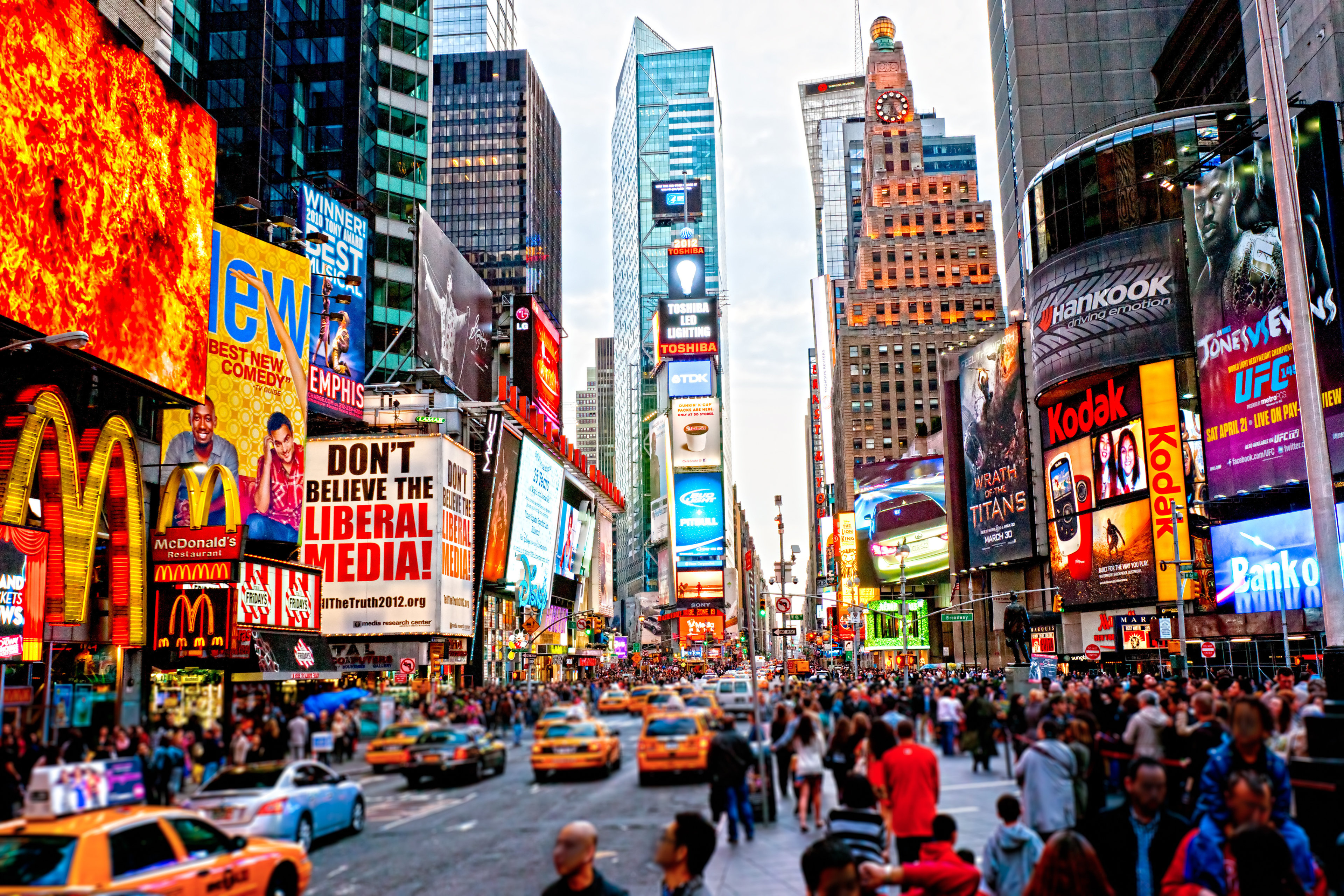 Times Square with countless billboards, advertisements, and news