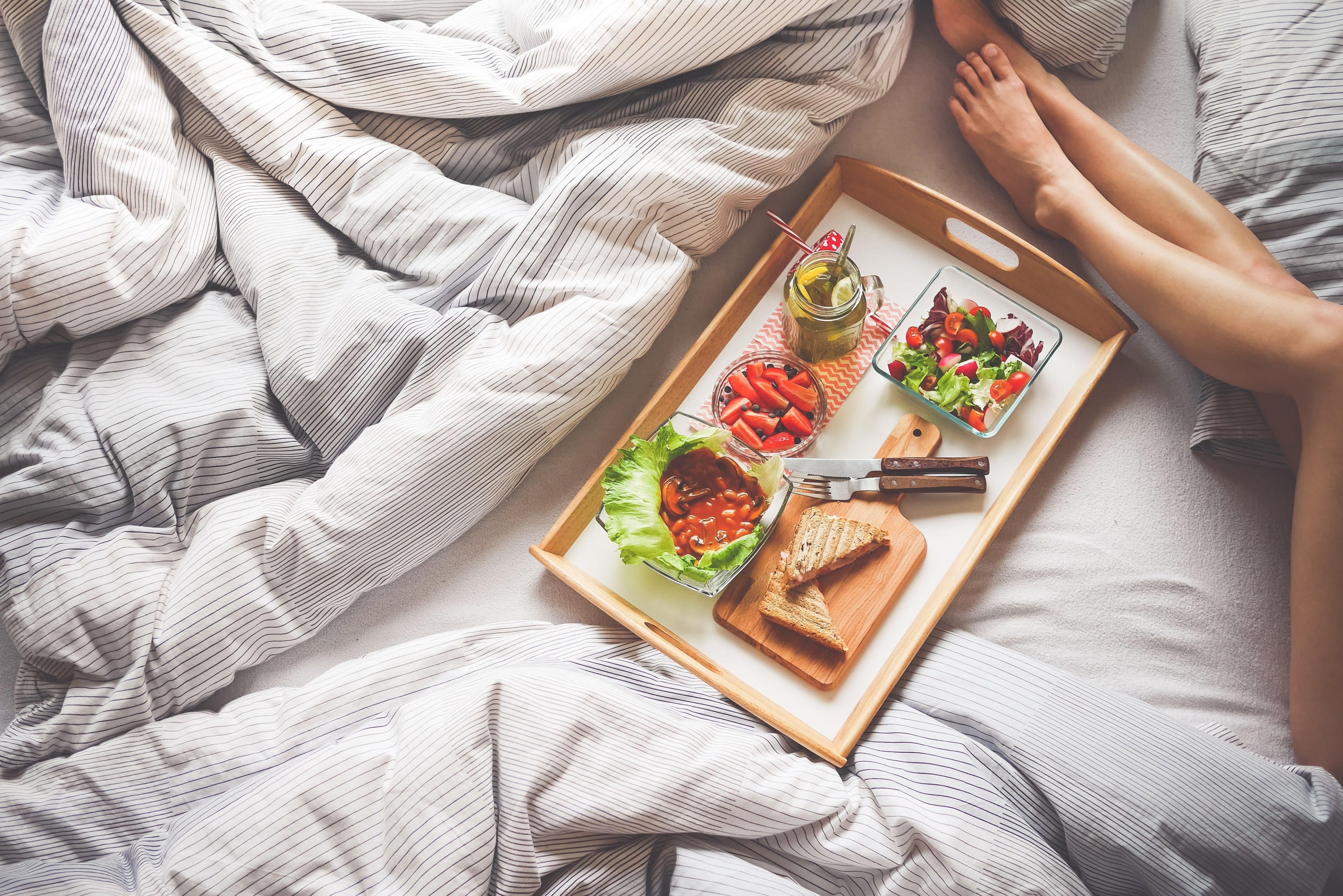Tablet and food in bed