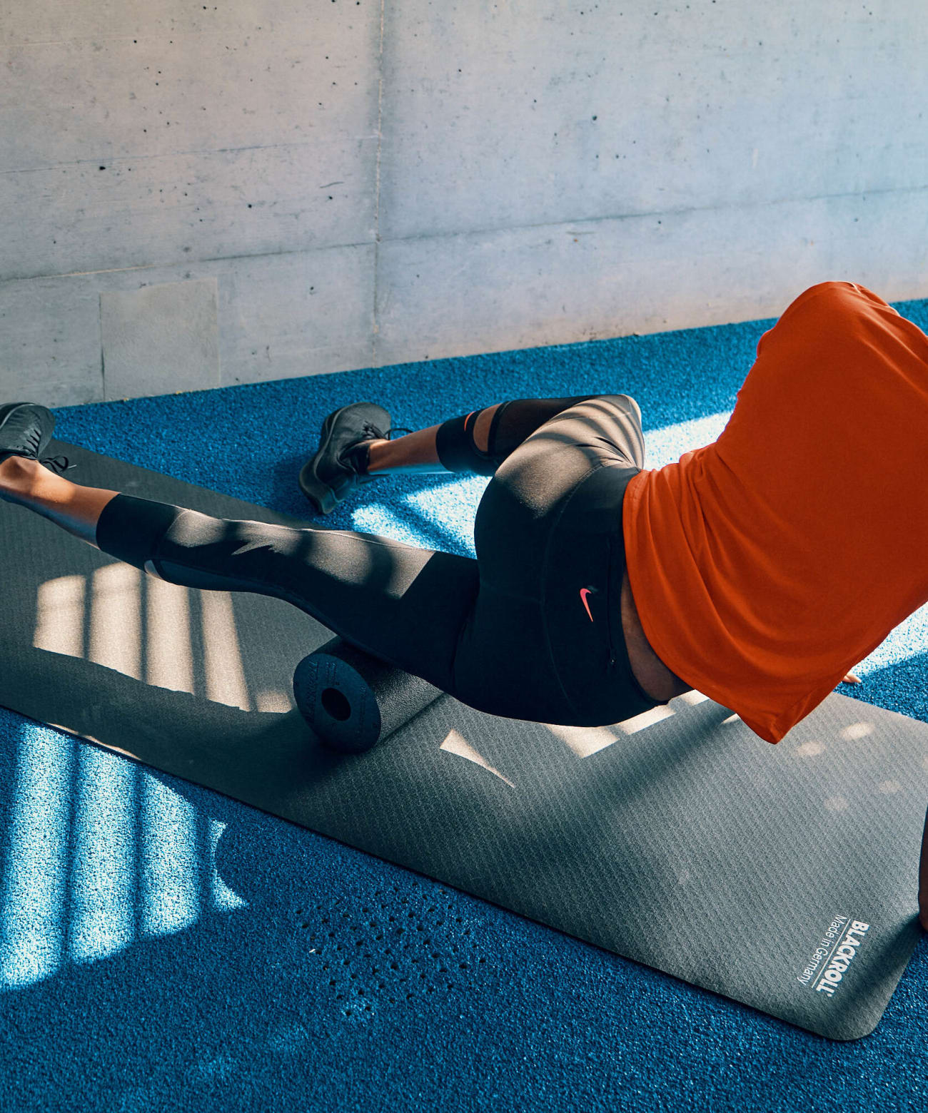 Track and field athlete, Yasmin Giger warms up for her training with BLACKROLL® exercises.