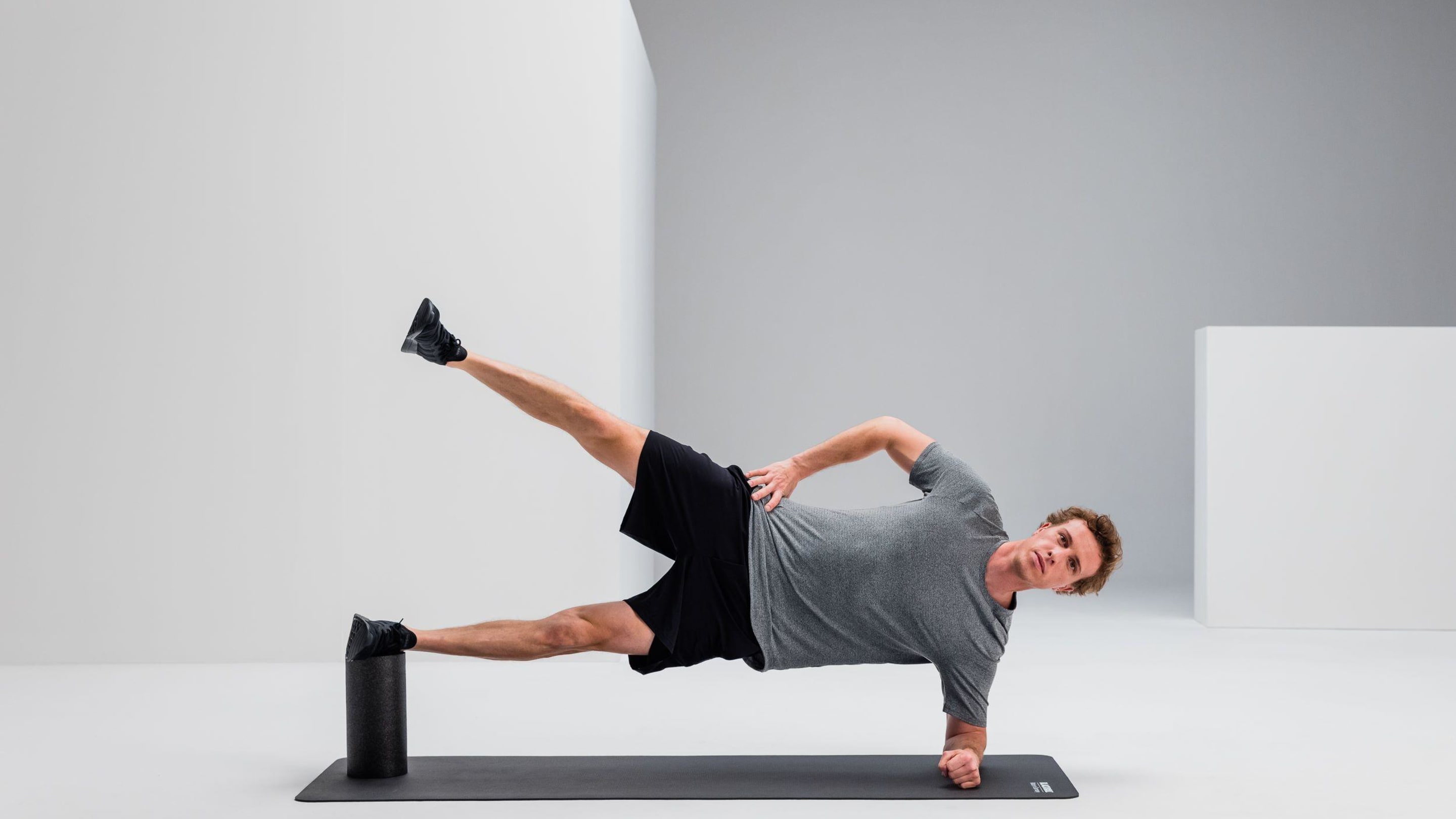 Side plank upper leg lifts strengthening