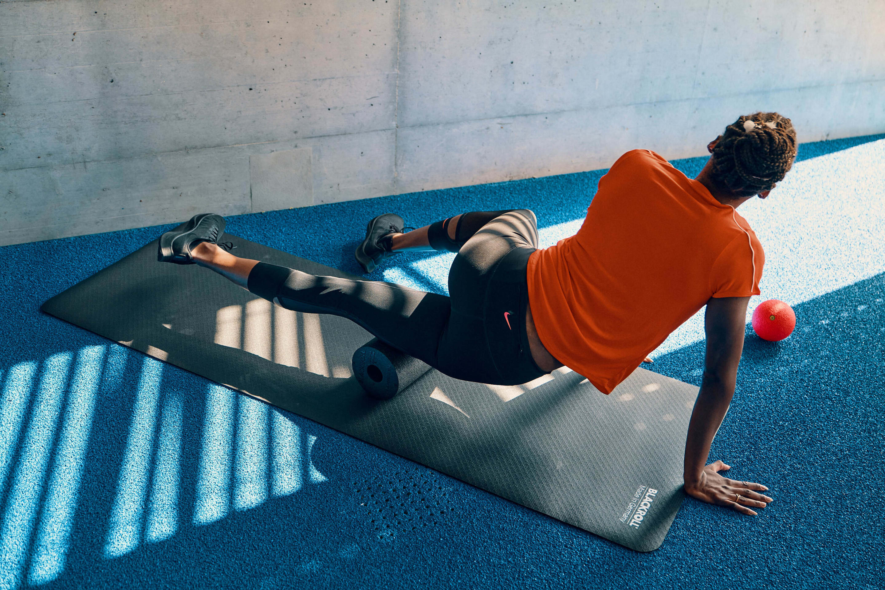 Track and field athlete, Yasmin Giger warms up for her training with BLACKROLL® exercises.