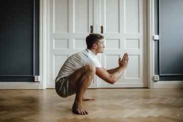 Deep squat (heel sit), stretching the superficial back line. Lift the sternum and stretch the spine.
