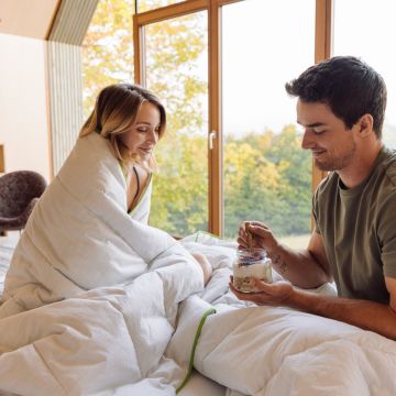 man and woman with blanket