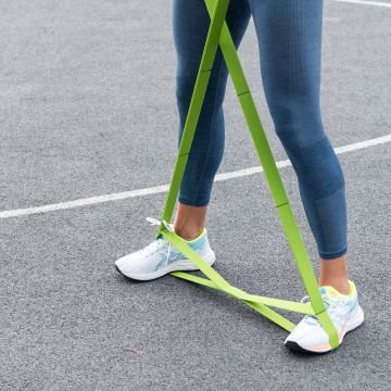 Woman exercises with MULTI BAND