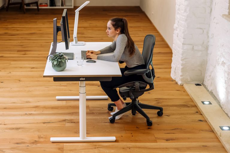 What helps to relieve back pain caused by sitting down for a long